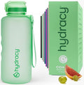 Hydracy Water Bottle with Time Marker -Large BPA Free Water Bottle & No Sweat Sleeve -Leak Proof Gym Bottle with Fruit Infuser Strainer & Times to Drink -Ideal for Fitness Sports & Outdoors